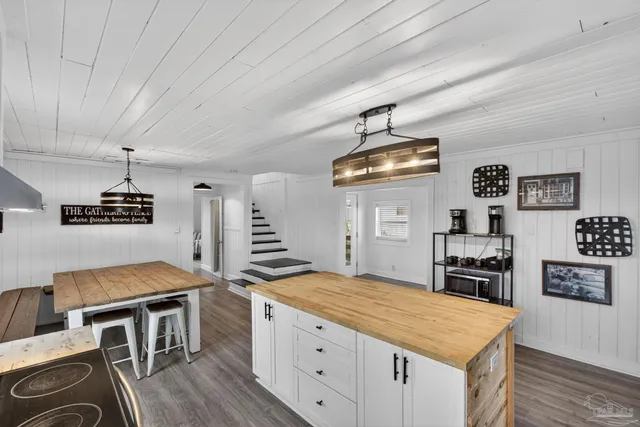 a kitchen with stainless steel appliances granite countertop a stove and a refrigerator