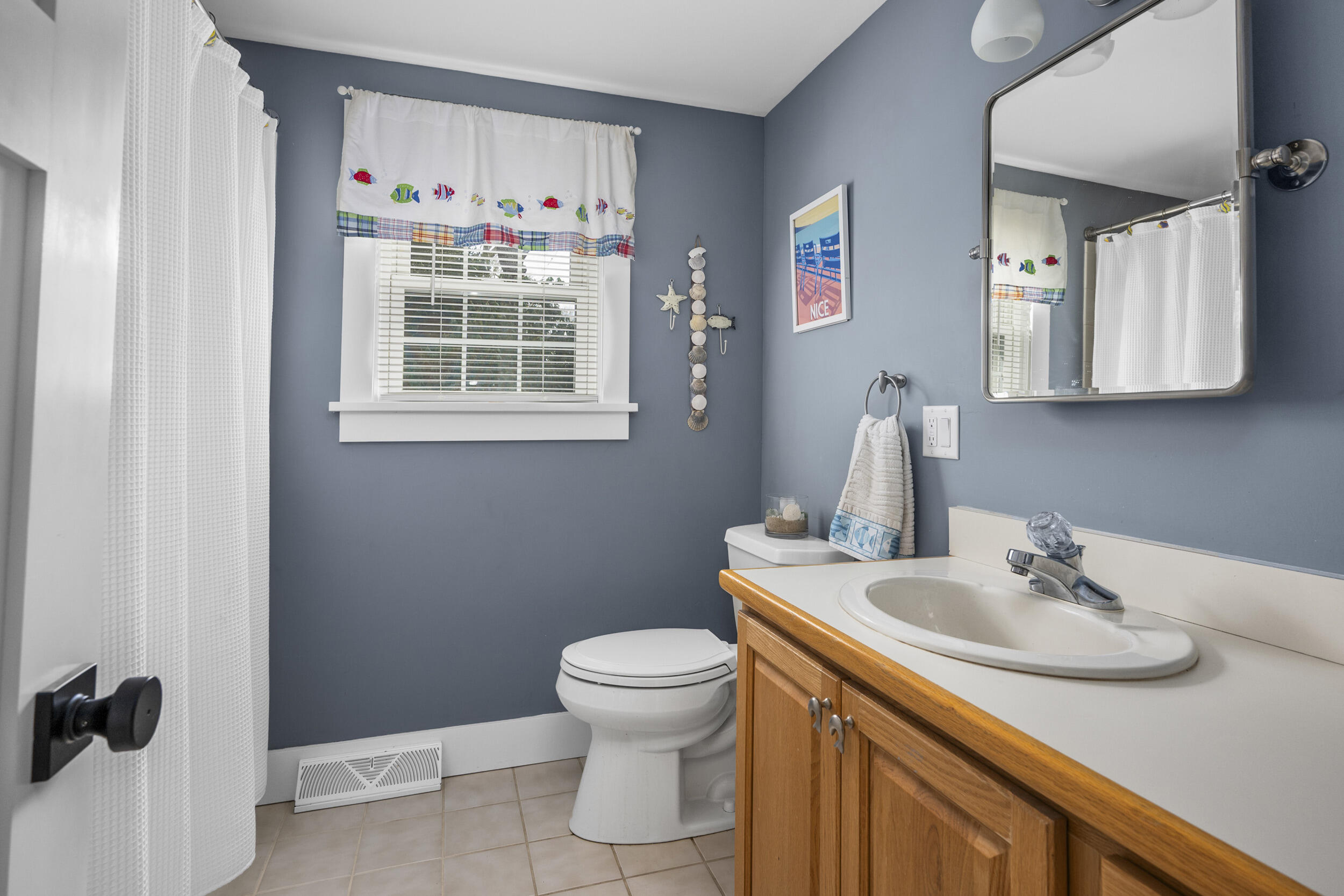 110 Fuller Road Centerville, MA 02632 - Photo 11 of 23 a bathroom with a sink toilet and a mirror