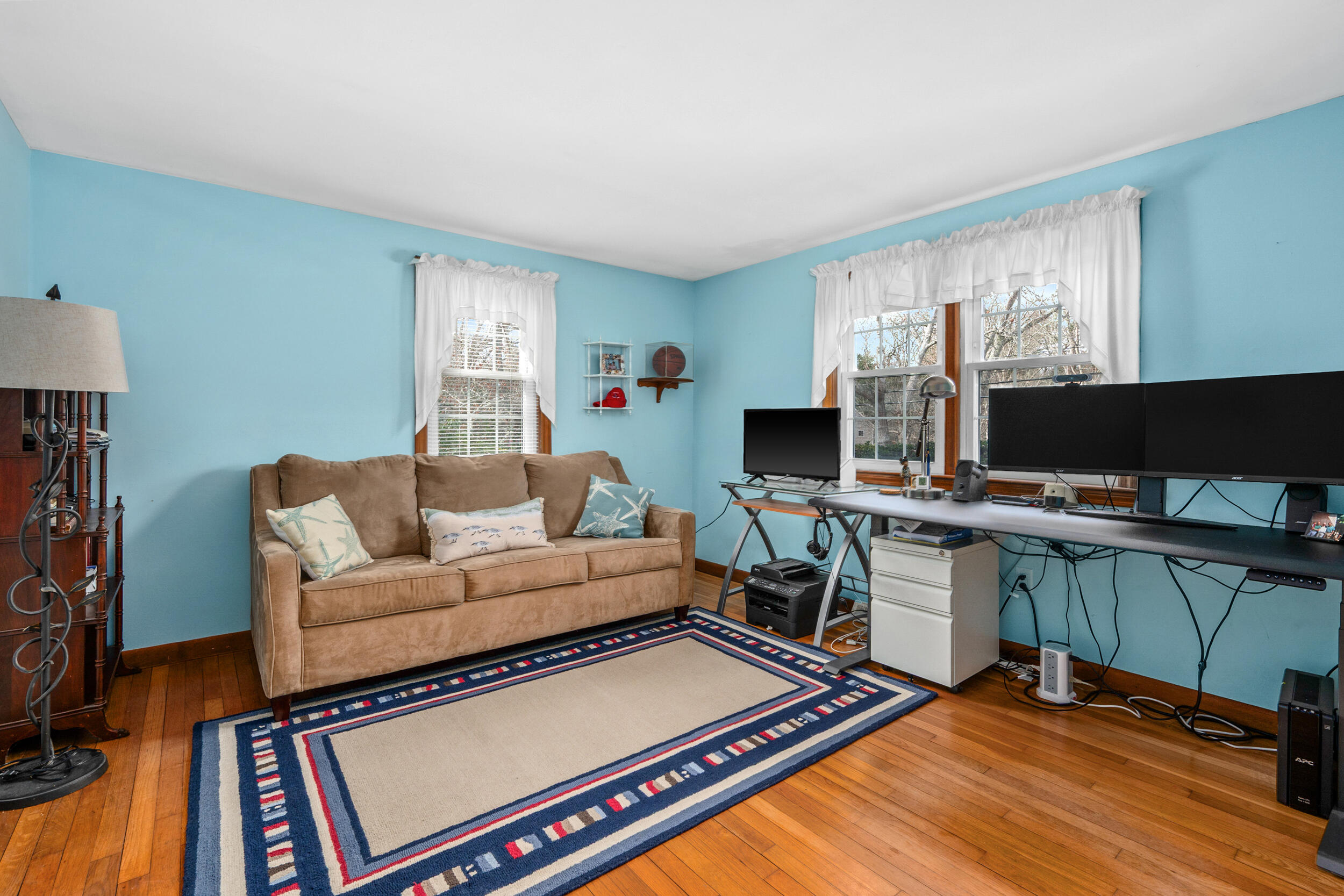 110 Fuller Road Centerville, MA 02632 - Photo 12 of 23 a living room with furniture a desk and a flat screen tv