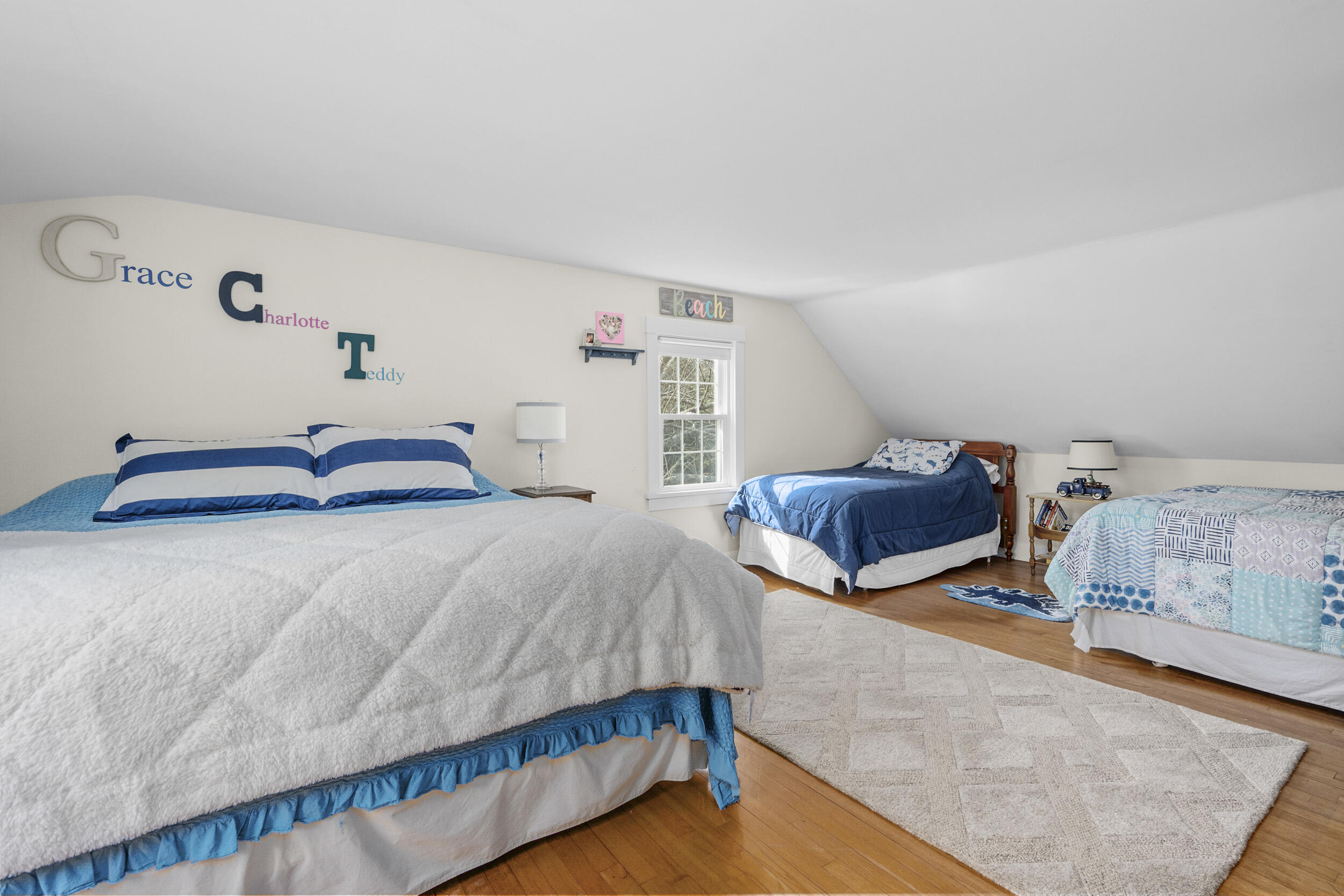 110 Fuller Road Centerville, MA 02632 - Photo 16 of 23 a bedroom with a bed and a wooden floor