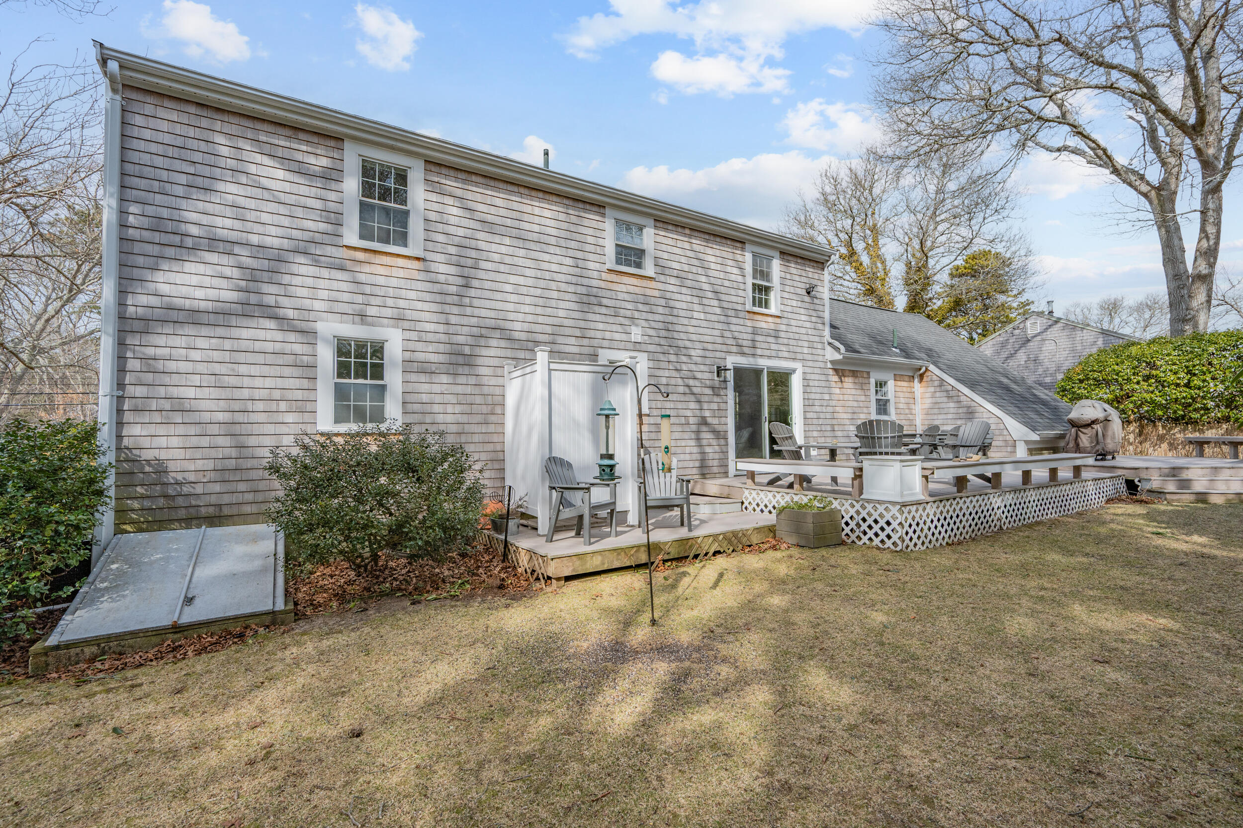 110 Fuller Road Centerville, MA 02632 - Photo 19 of 23 a view of a house with a big yard and large tree