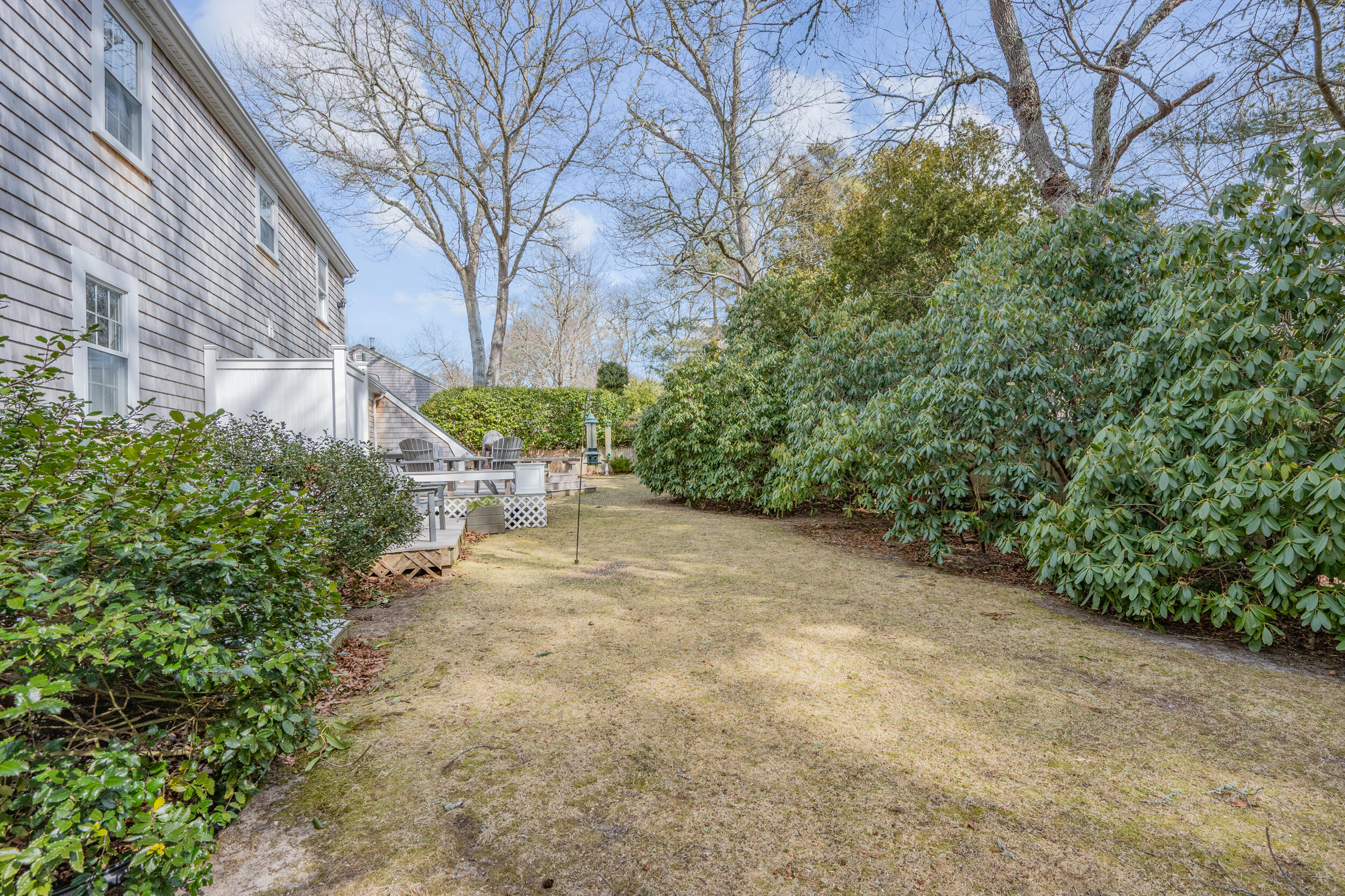 110 Fuller Road Centerville, MA 02632 - Photo 23 of 23 a view of a backyard with large trees