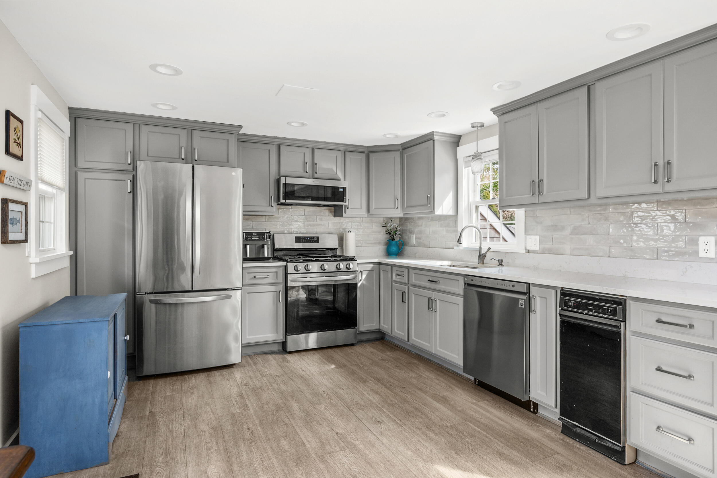 110 Fuller Road Centerville, MA 02632 - Photo 3 of 23 a kitchen with a refrigerator stove and sink