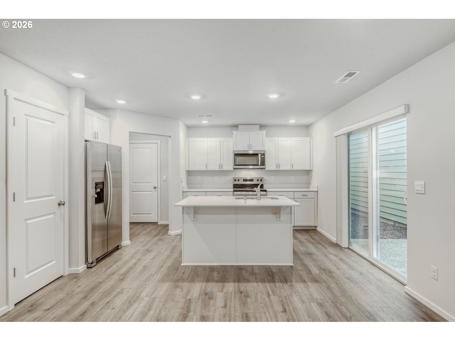 1109 Southeast 193rd Place Camas, WA 98607 - Photo 11 of 29 a view of kitchen with stainless steel appliances refrigerator stove microwave and cabinets