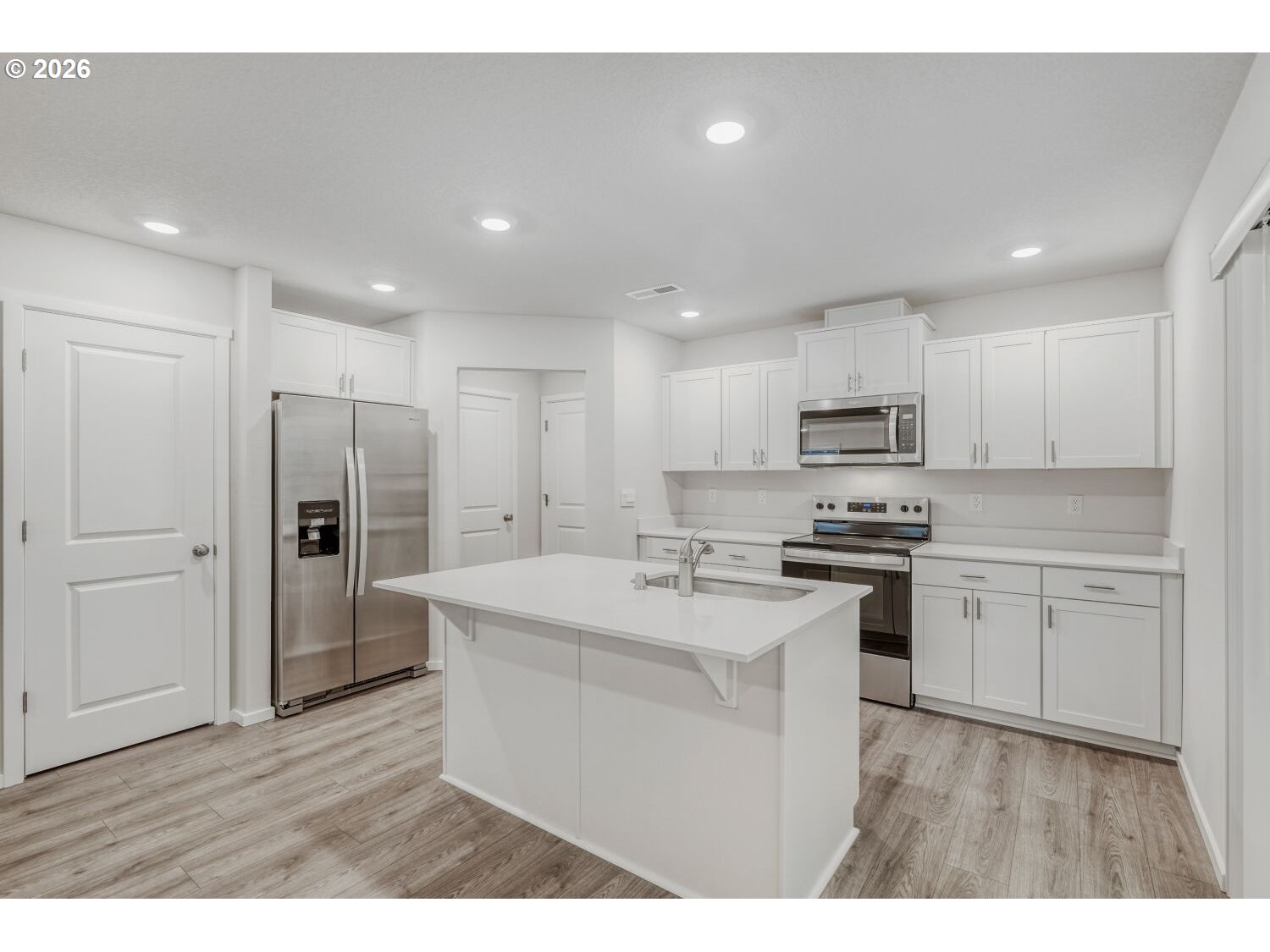 1109 Southeast 193rd Place Camas, WA 98607 - Photo 12 of 29 a kitchen with stainless steel appliances a refrigerator stove and sink
