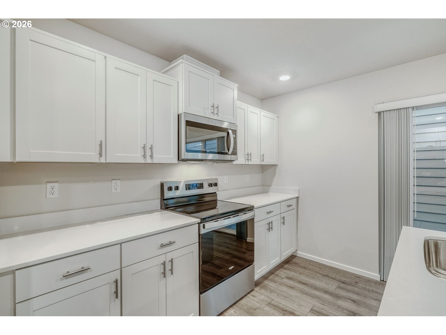 1109 Southeast 193rd Place Camas, WA 98607 - Photo 15 of 29 a kitchen with sink a microwave and cabinets