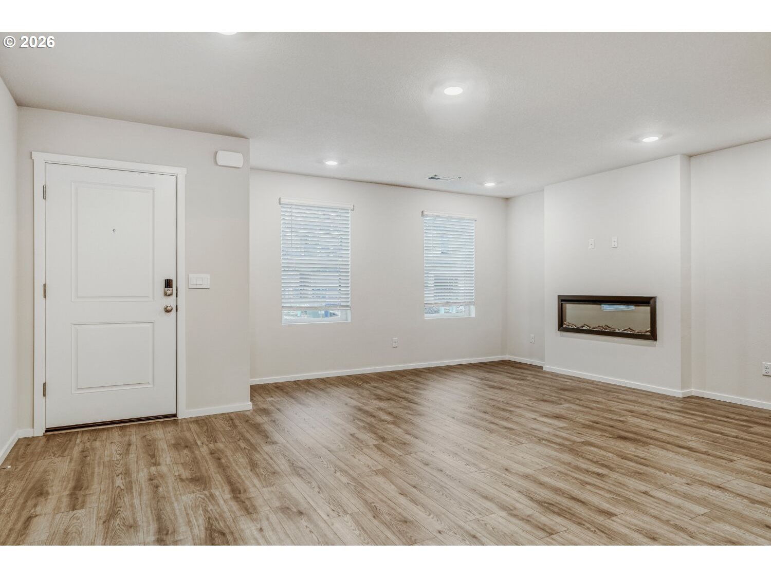 1109 Southeast 193rd Place Camas, WA 98607 - Photo 5 of 29 a view of an empty room with wooden floor and window