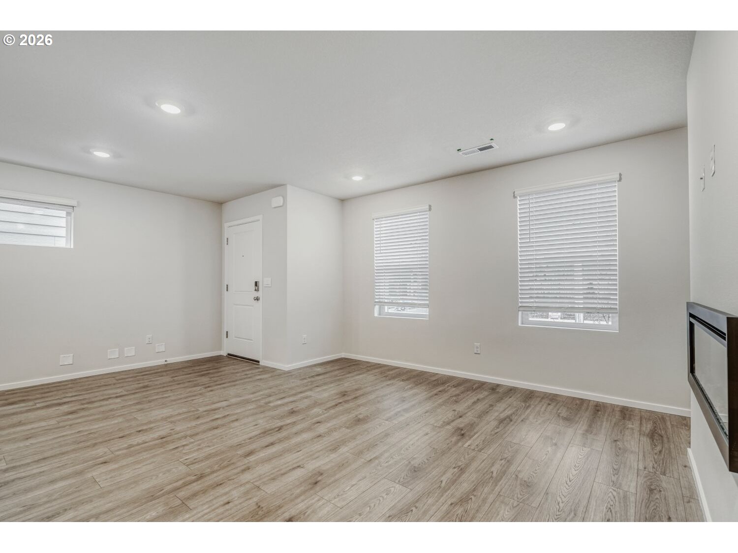 1109 Southeast 193rd Place Camas, WA 98607 - Photo 8 of 29 a view of an empty room with wooden floor and a window