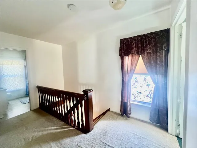 a bedroom with a bed and a table in it