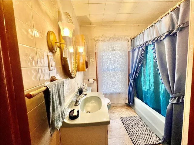 a swimming pool with outdoor seating and yard