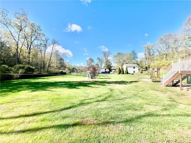 a view of a swimming pool with an outdoor space and seating area