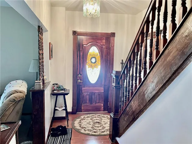 a view of entryway with wooden floor