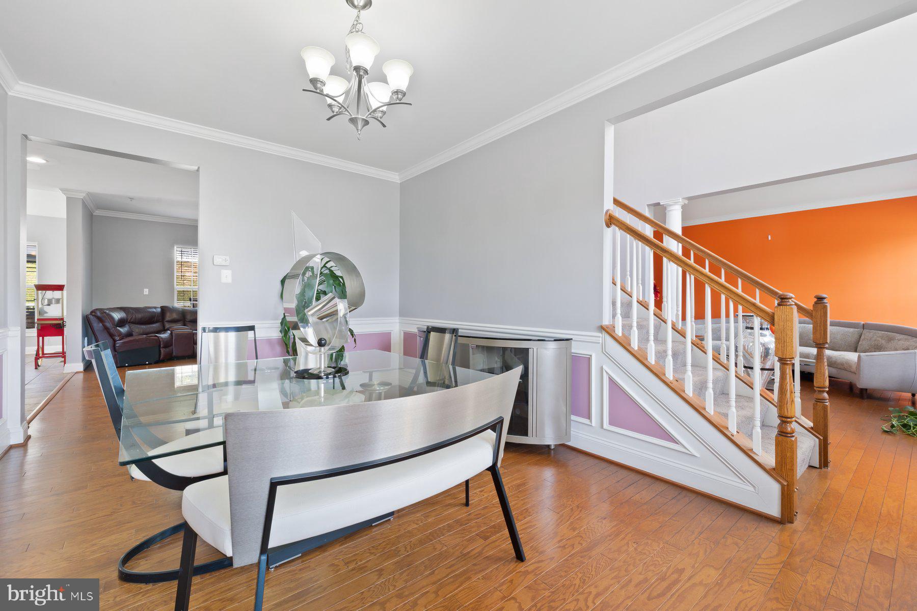 6 Cedar Grove Court Baltimore, MD 21237 - Photo 12 of 50 a dining room with furniture a chandelier and wooden floor