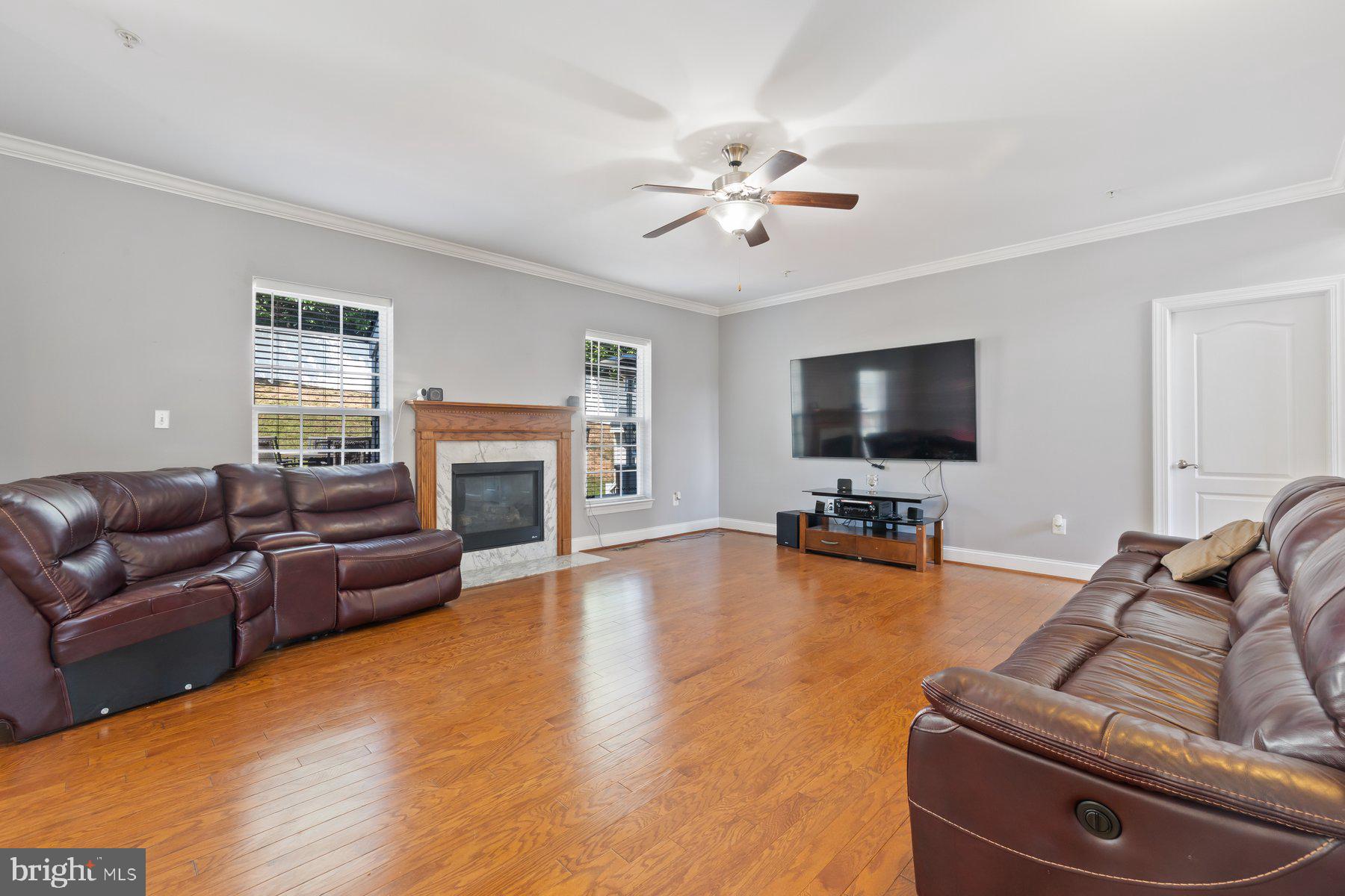 6 Cedar Grove Court Baltimore, MD 21237 - Photo 18 of 50 a living room with furniture and a flat screen tv