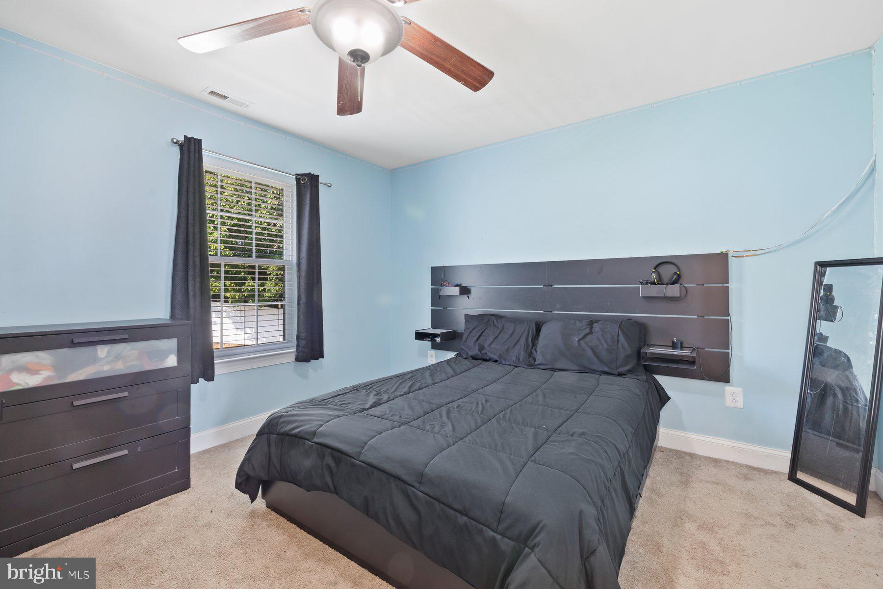 6 Cedar Grove Court Baltimore, MD 21237 - Photo 24 of 50 a bedroom with a bed and a window