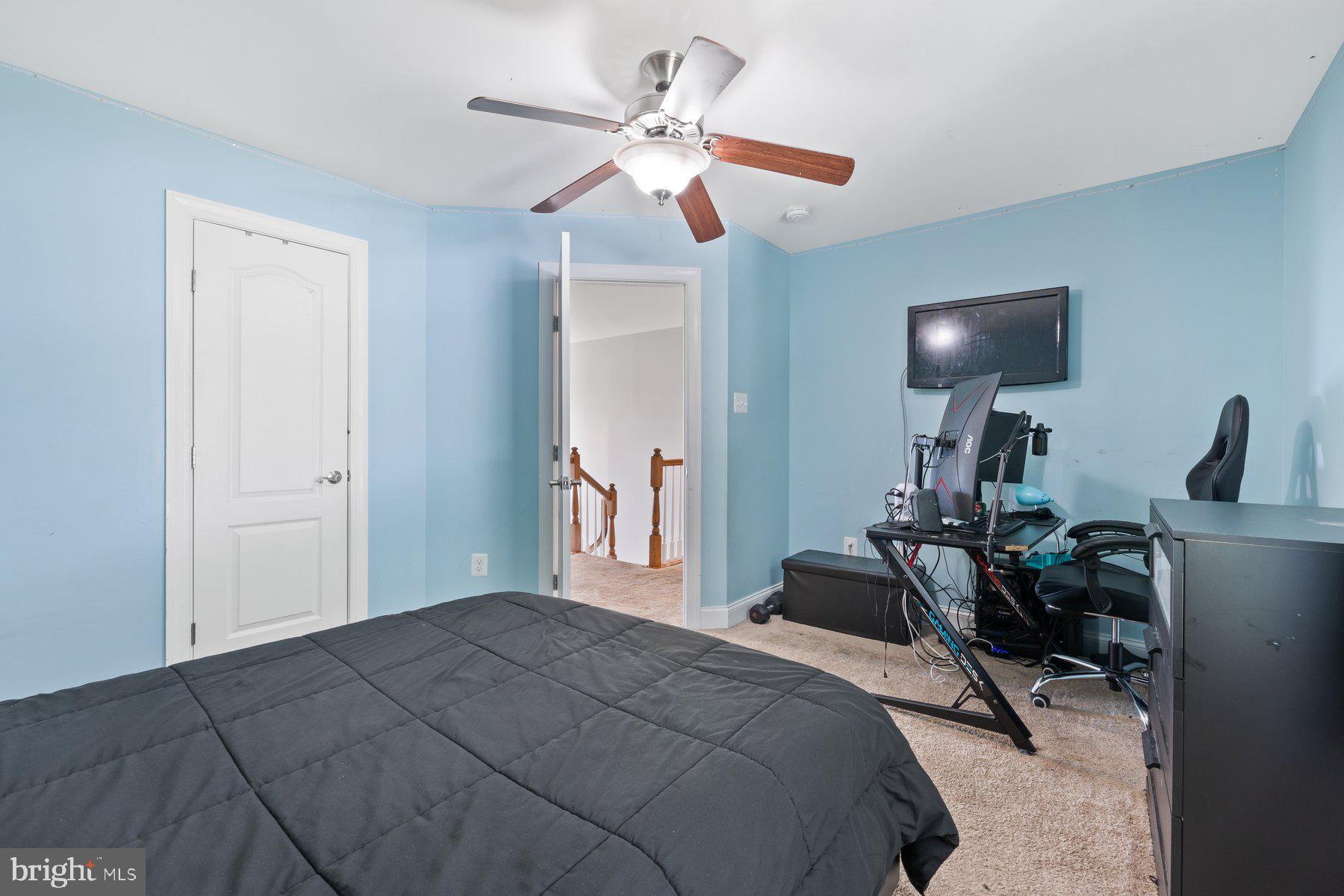 6 Cedar Grove Court Baltimore, MD 21237 - Photo 25 of 50 a bedroom with a bed a chandelier and a window