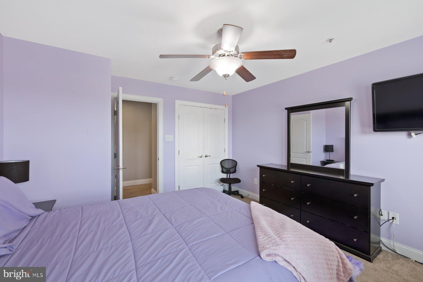 6 Cedar Grove Court Baltimore, MD 21237 - Photo 28 of 50 a bedroom with a bed and a flat screen tv