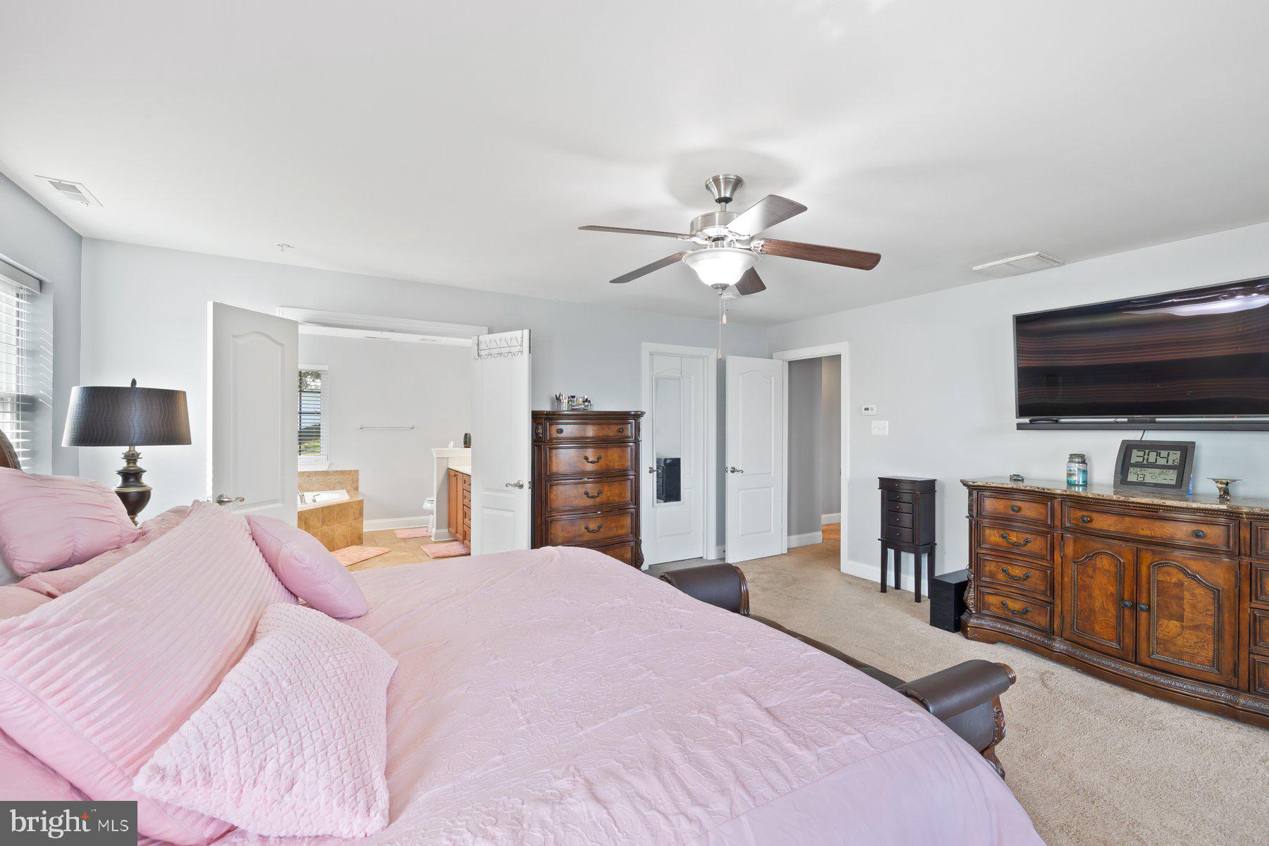 6 Cedar Grove Court Baltimore, MD 21237 - Photo 33 of 50 a bedroom with a bed and a flat screen tv