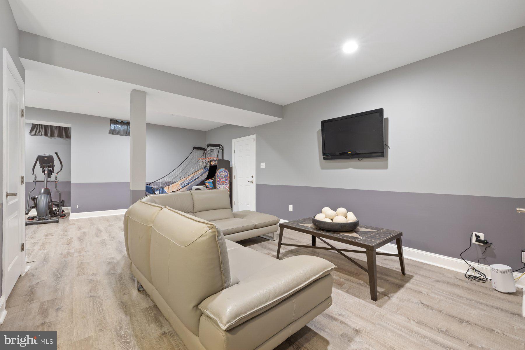 6 Cedar Grove Court Baltimore, MD 21237 - Photo 38 of 50 a living room with furniture and a flat screen tv