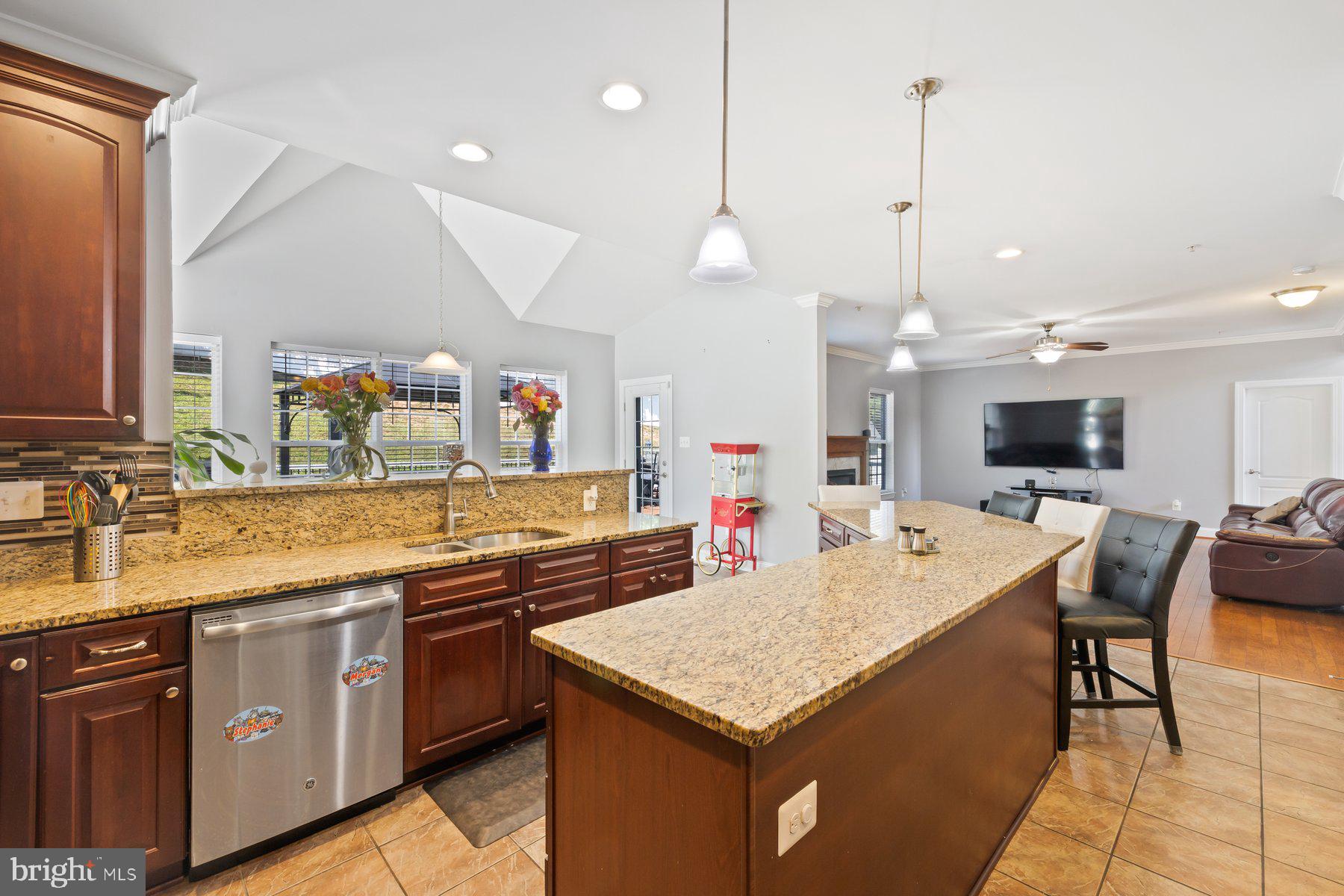 6 Cedar Grove Court Baltimore, MD 21237 - Photo 4 of 50 a kitchen with a kitchen island and stainless steel appliances