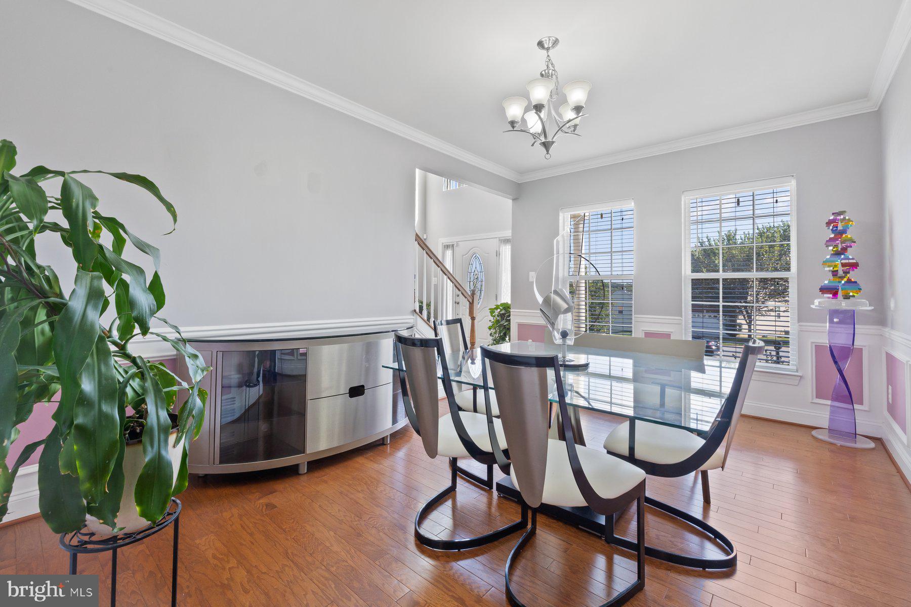 6 Cedar Grove Court Baltimore, MD 21237 - Photo 9 of 50 a dining room with furniture a chandelier and wooden floor