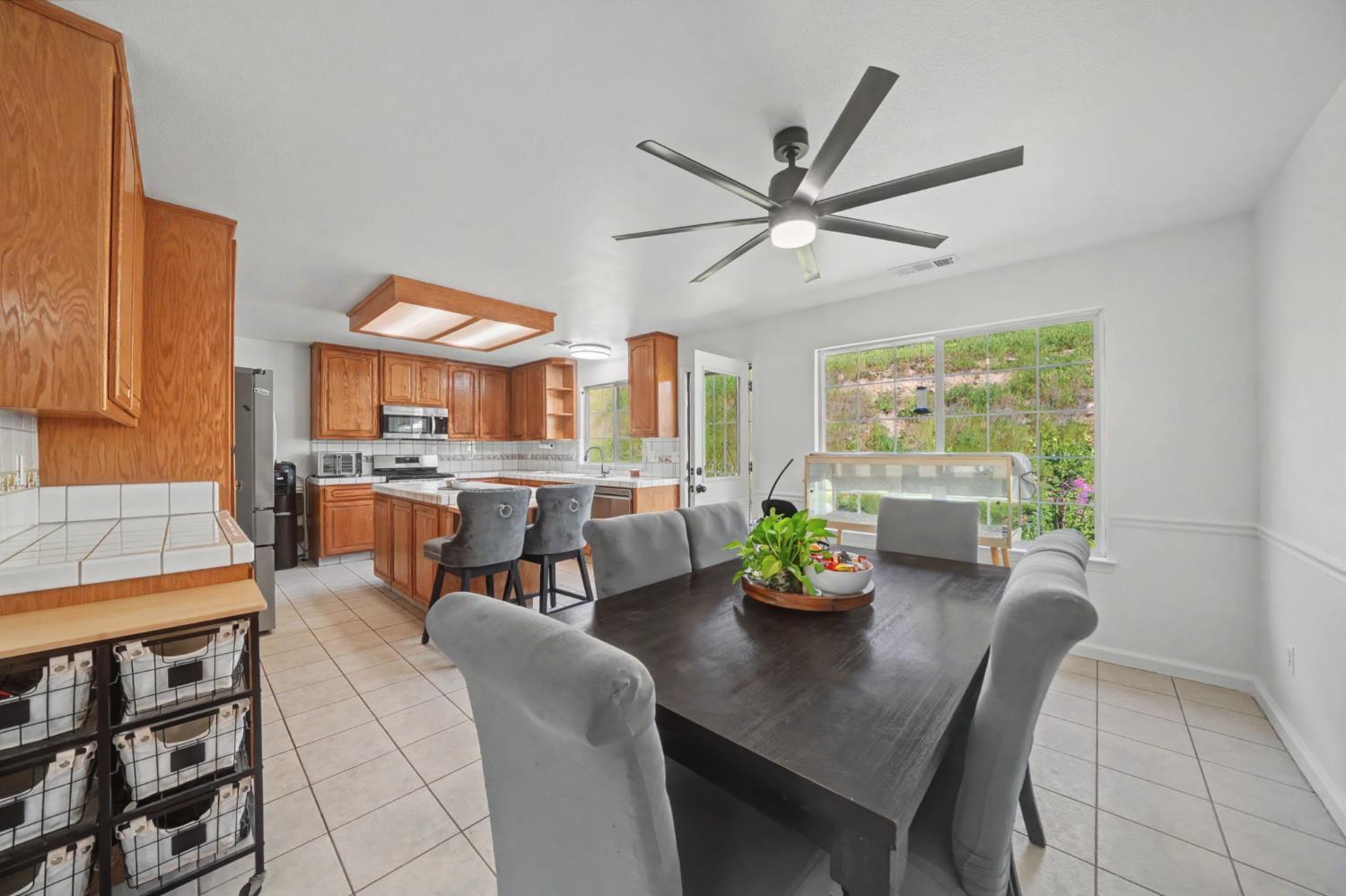 7761 Jenny Lind Road Valley Springs, CA 95252 - Photo 8 of 35 a dining room filled with furniture and a potted plant
