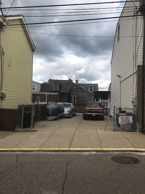 3439 Denny Street Pittsburgh, PA 15201 - Photo 2 of 23 Parking next to the duplex. Large enough for 4 cars or expanding the property