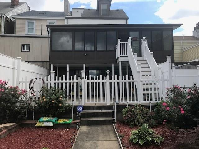 3439 Denny Street Pittsburgh, PA 15201 - Photo 4 of 23 Rear view of 3441 Denny. Back yard leading onto a patio. Right portion of the picture with the fence is also owned by 3441. A lot of possibilities here!