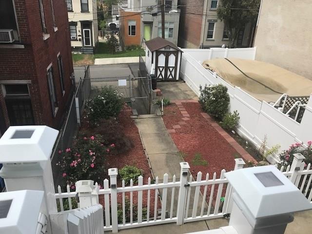 3439 Denny Street Pittsburgh, PA 15201 - Photo 5 of 23 Looking down from the screened-in back porch. Quaint back yard replete with a storage shed and another parking pad