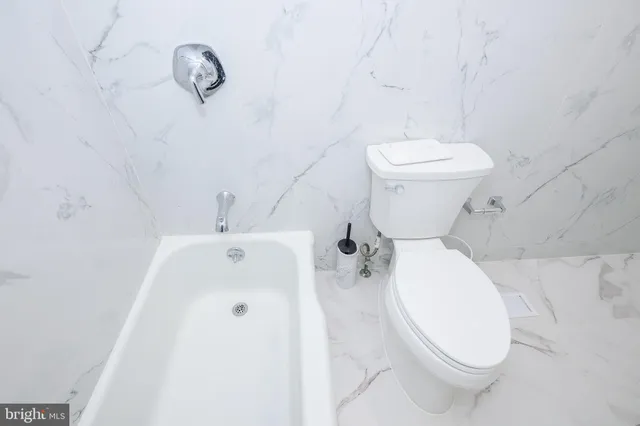 a bedroom with a bed and a table