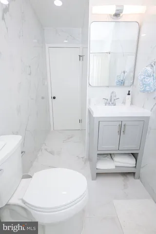 a bedroom with a bed and a table