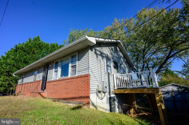 a kitchen with stainless steel appliances cabinets a counter space and a refrigerator