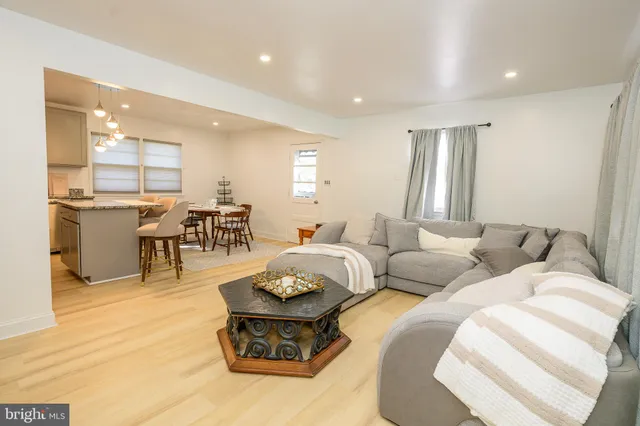 a spacious bedroom with a bed and a window