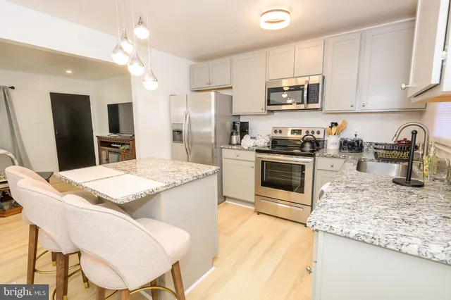 a bedroom with a bed and a night stand