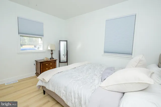 a white toilet sitting next to a bath tub