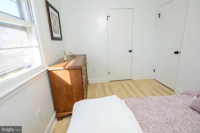 a white toilet sitting next to a white sink