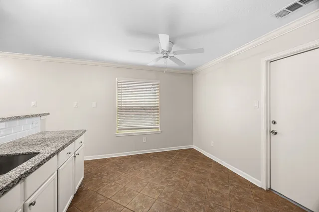 a kitchen with stainless steel appliances a stove sink and cabinets