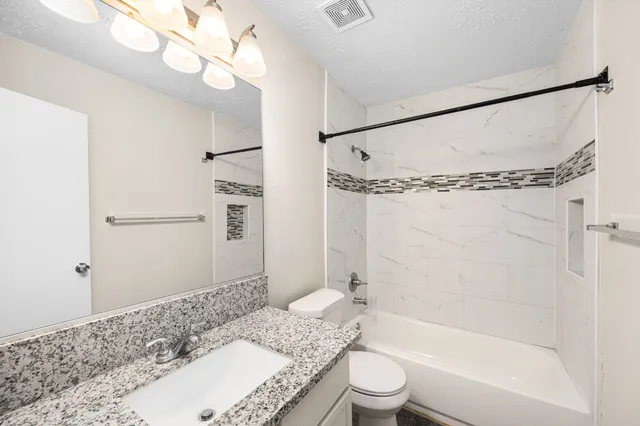 a bathroom with a sink a mirror and a window