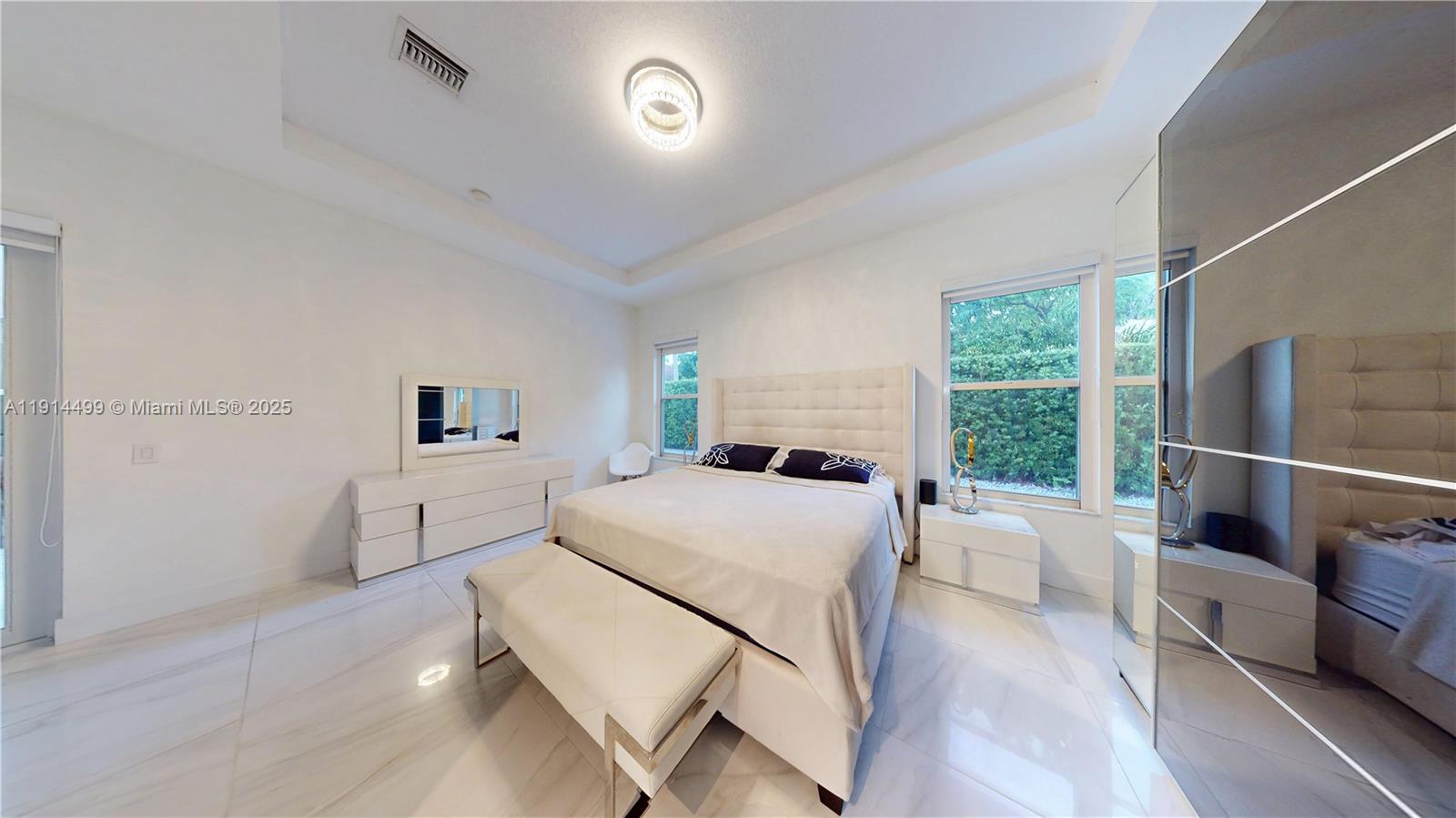 1946 Harbor View Circle Weston, FL 33327 - Photo 15 of 26 a room with a bed and a large window