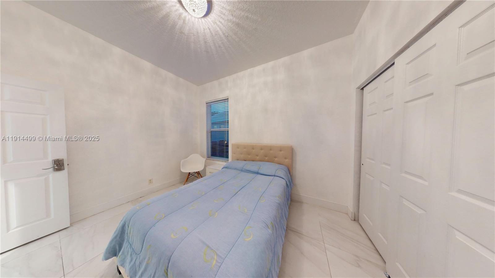1946 Harbor View Circle Weston, FL 33327 - Photo 20 of 26 a bedroom with a bed and a shower