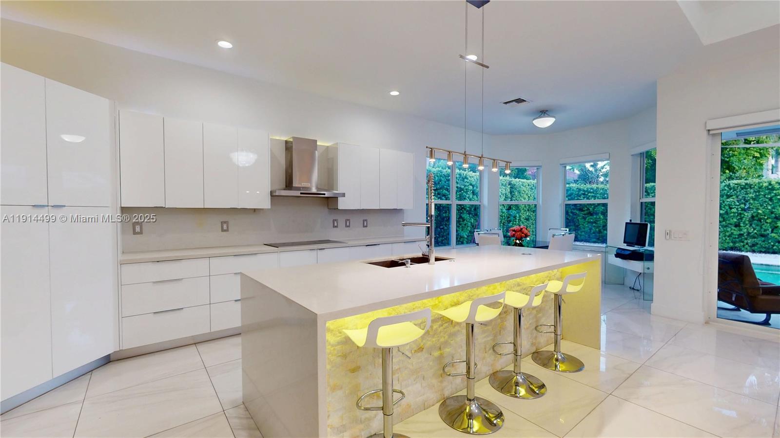 1946 Harbor View Circle Weston, FL 33327 - Photo 8 of 26 a kitchen with a sink window and cabinets