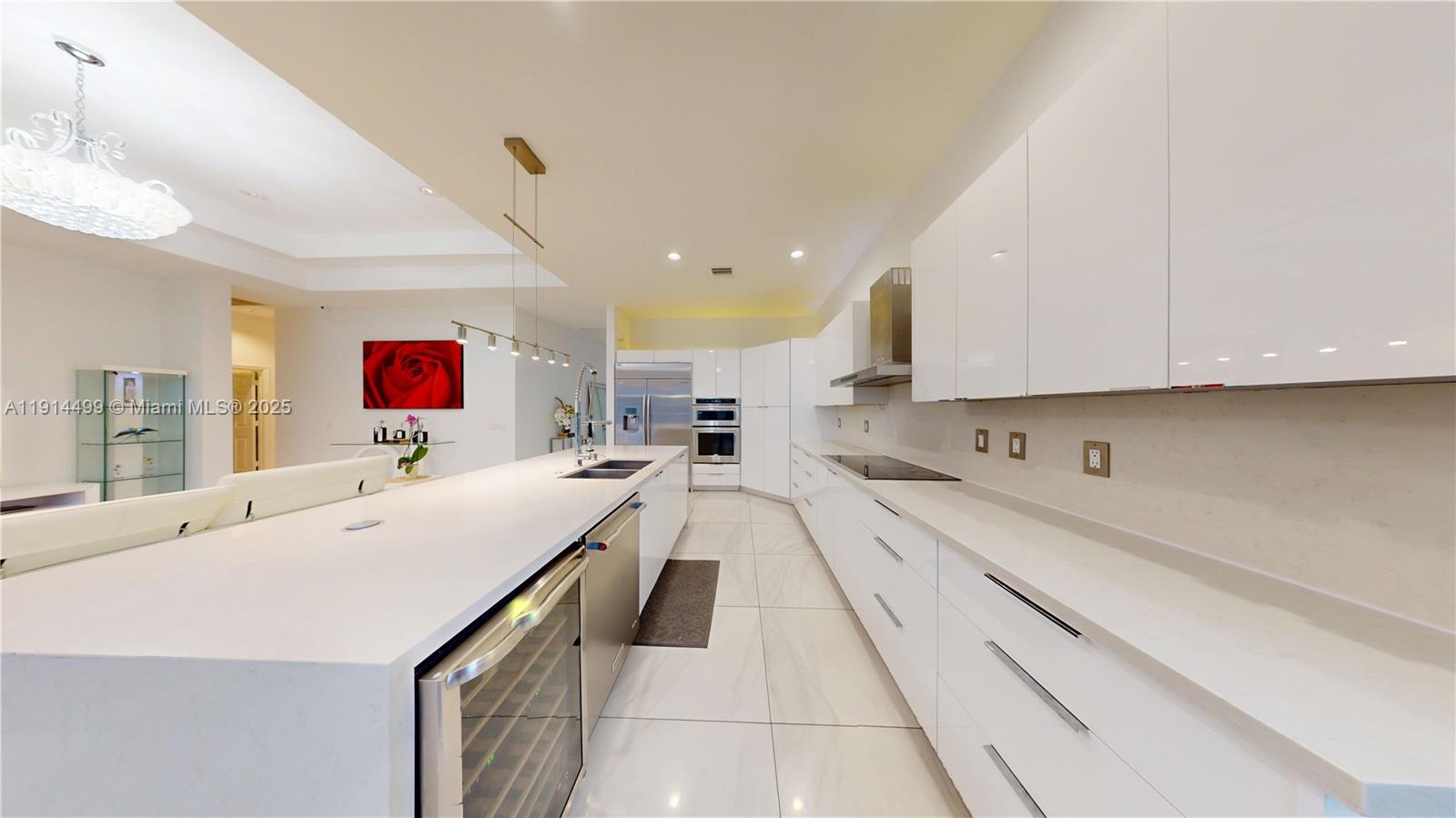 1946 Harbor View Circle Weston, FL 33327 - Photo 10 of 26 a large white kitchen with a large window