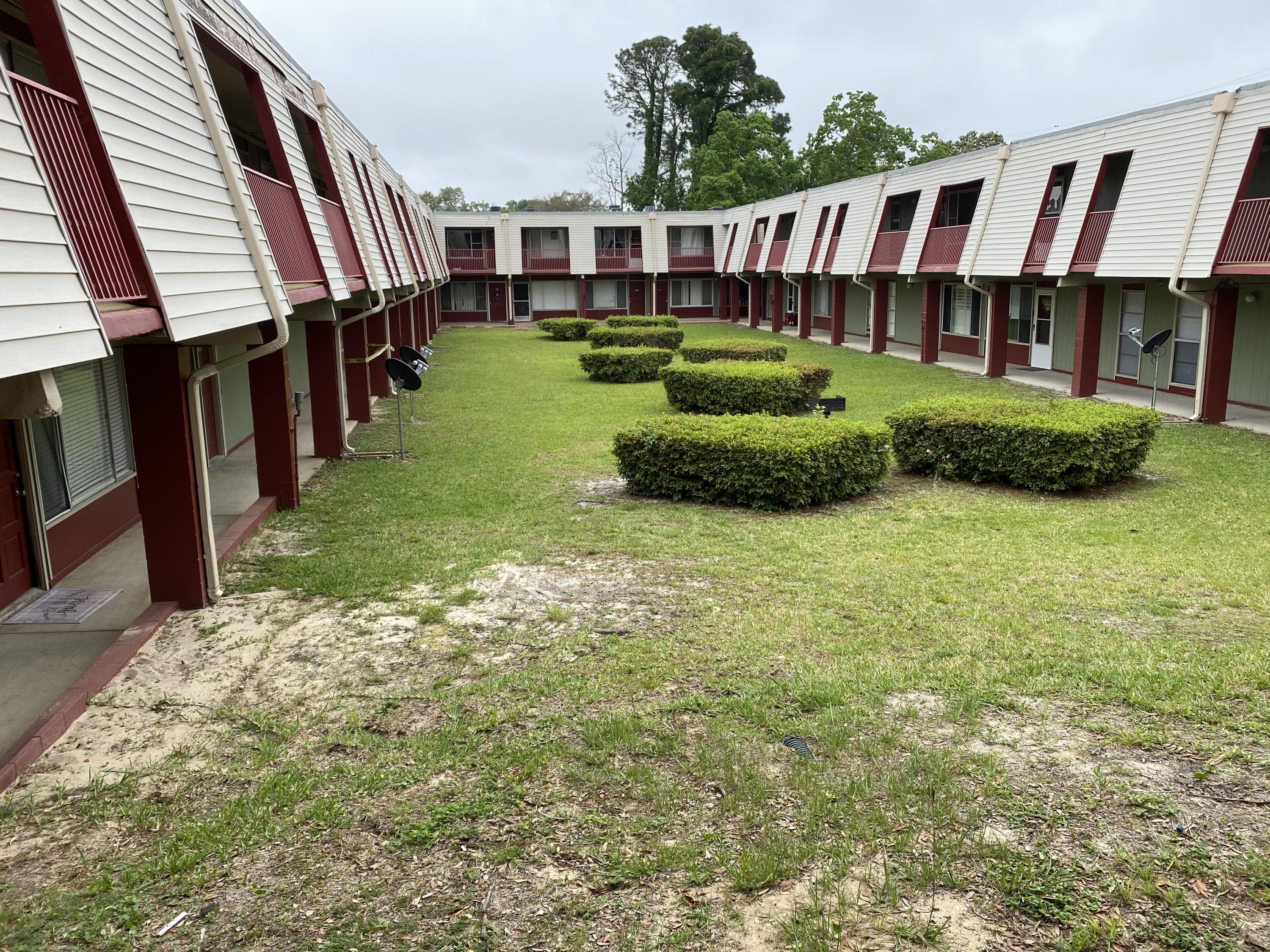 210 Pelham Road, Unit 113C Fort Walton Beach, FL 32547 - Photo 2 of 4 a view of an house with backyard space and balcony