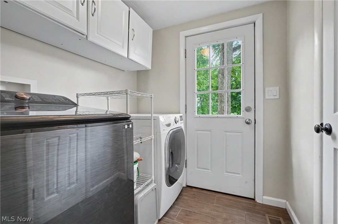 952 Ravenna Road Kent, OH 44240 - Photo 9 of 37 Laundry area with half bath access and door leading to backyard.