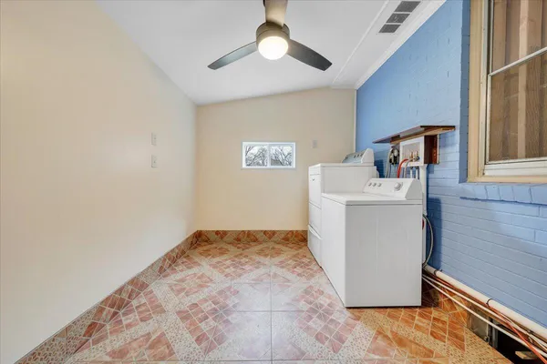 a kitchen with a stove a sink and a refrigerator