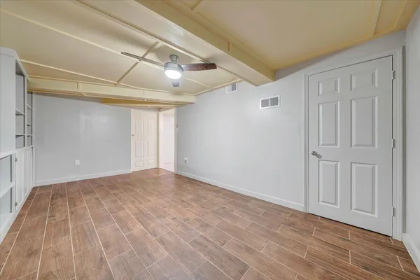 a white toilet sitting next to a bathroom sink