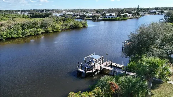 an aerial view of a house with a lake view
