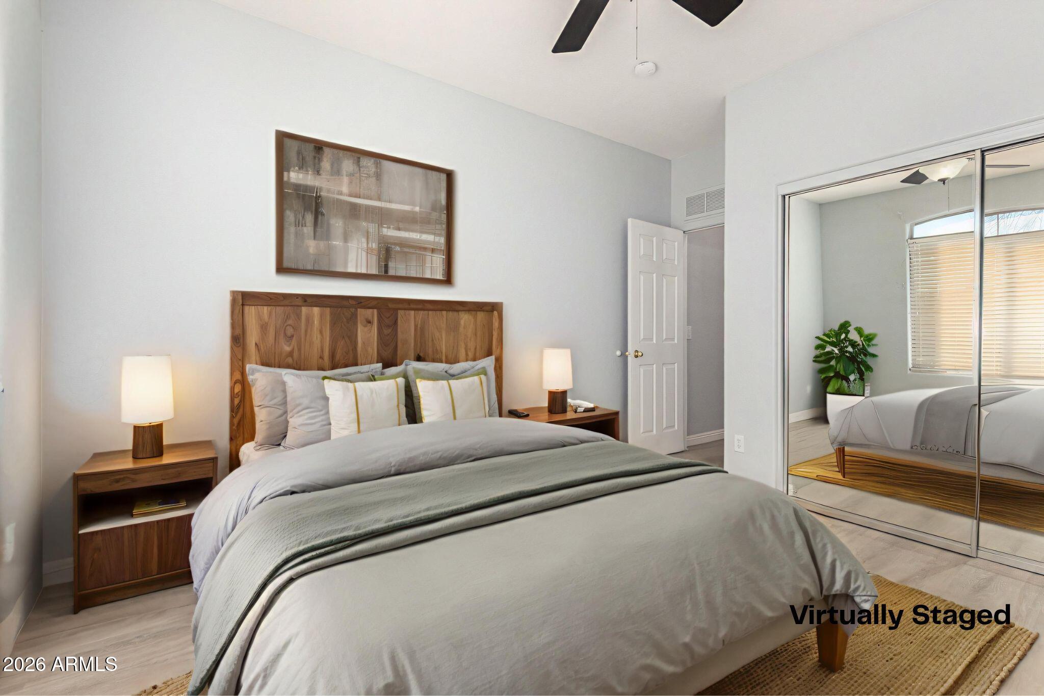 3230 South 74th Lane Phoenix, AZ 85043 - Photo 21 of 57 a bedroom with a large bed and a couch