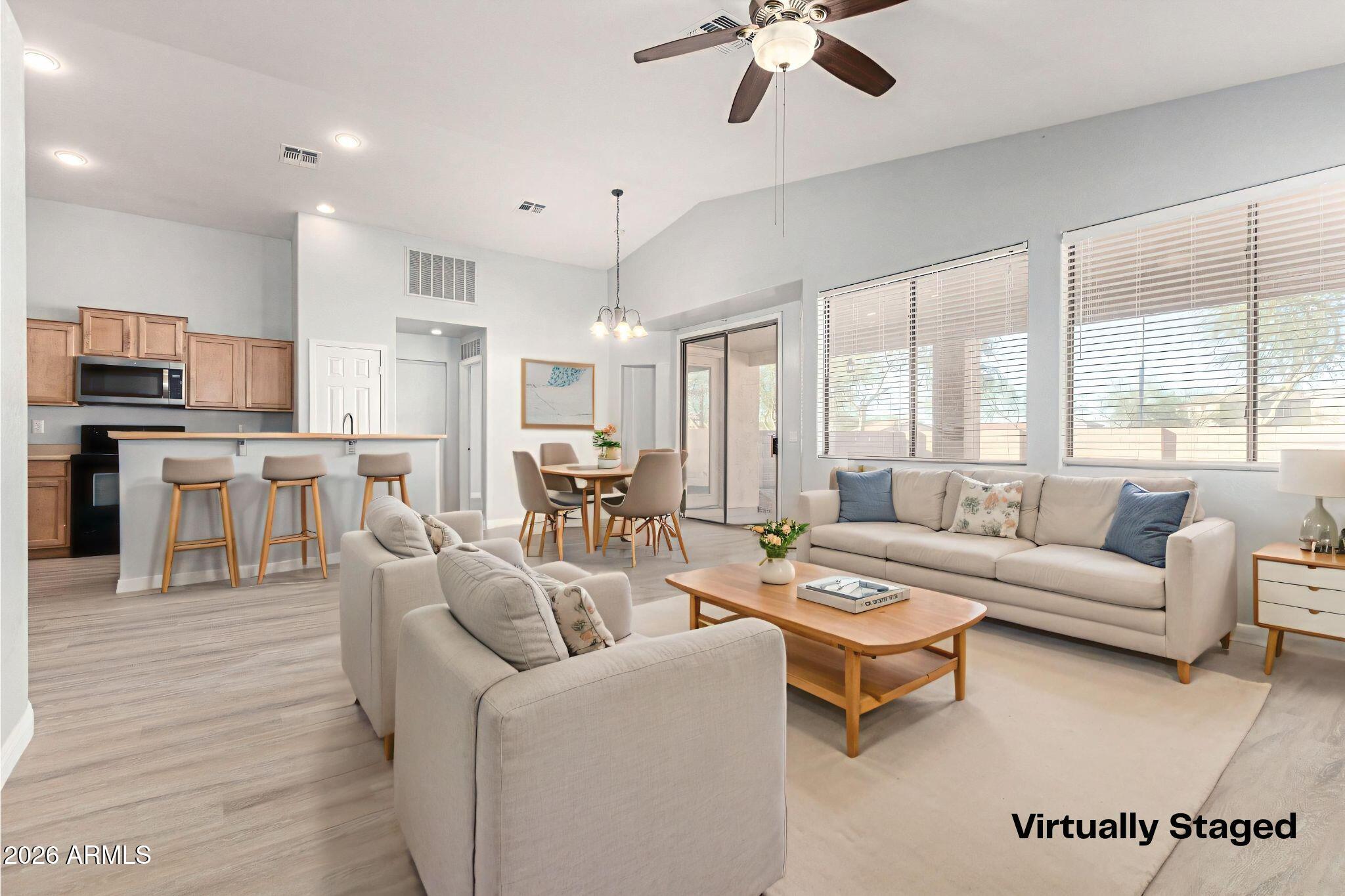 3230 South 74th Lane Phoenix, AZ 85043 - Photo 4 of 57 a living room with furniture and a large window