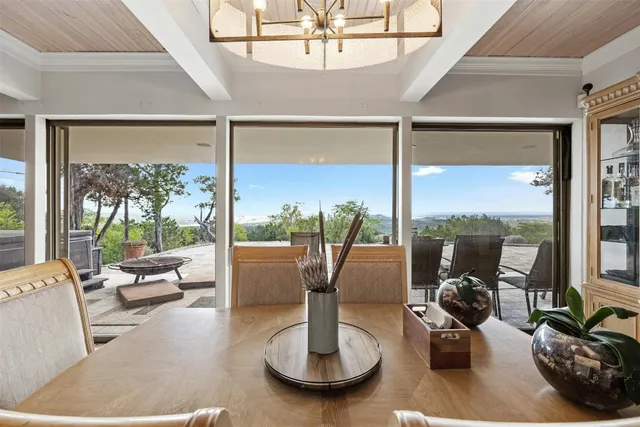 a view of a dining room with furniture window and outside view